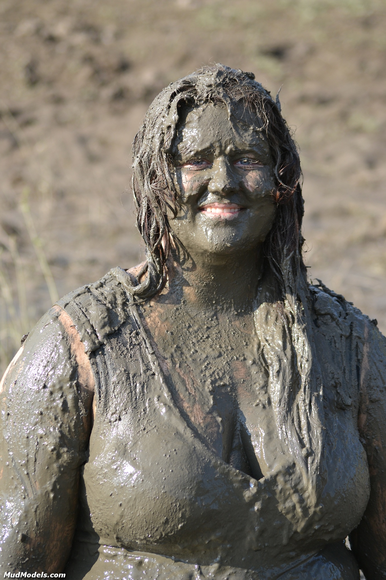 Deveny diving face first in the wet mud, her sheer dress soon is covered in...